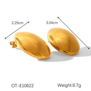 Detailed view of gold-plated bean stud earrings showing dimensions and brushed texture