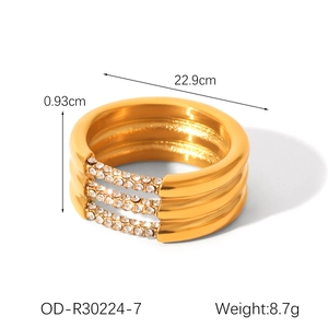 Detailed view of triple-layered 18k gold plated ring with sparkling rhinestone inlay details