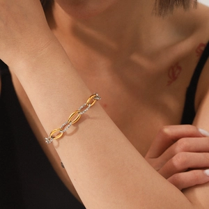 Two-tone 18K gold and silver stainless steel chain bracelet with textured link design
