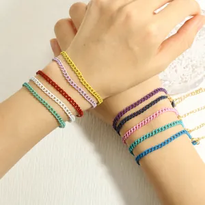 Close-up of colorful enamel Cuban link chains with gold lobster clasp and extension