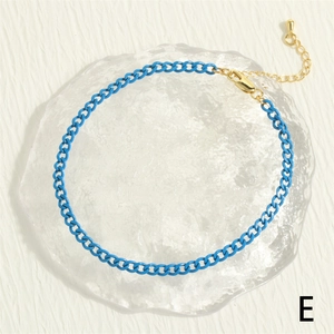 Detail of blue lacquer chain with gold lobster clasp and adjustable extension link