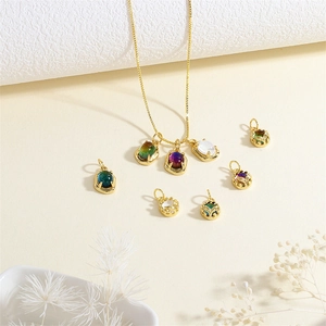 18K gold-plated necklace with oval gemstone pendants and intricate hollowed filigree design