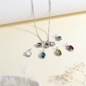 Elegant 18K gold-plated silver chain necklace featuring colorful iridescent oval pendants