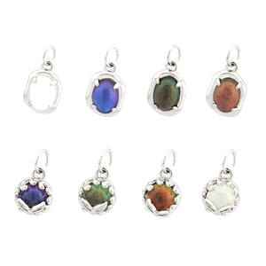 Detailed view of 18K gold plated oval pendant settings with colorful iridescent stones