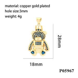 Detail of gold plated bear pendant with blue zircons and crown, 28mm size measurement