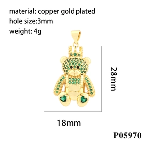 Detailed macro view of 28x18mm teddy bear pendant with green crystals and crown
