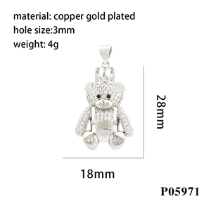 Macro detail of crown bear pendant in copper gold plated with micro-pave zirconia settings