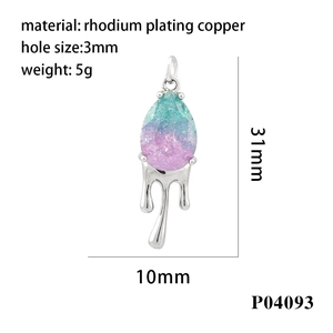 Macro detail of rhodium plated water drop pendant with purple and cyan gradient crystal