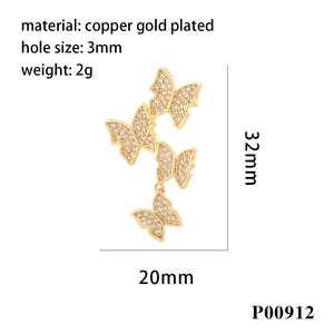 Detail of copper gold plated butterfly pendant with white zircons and dimensions 32x20mm