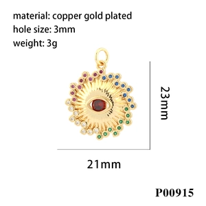 Macro shot of gold-plated evil eye pendant with colorful zircons and a red center stone