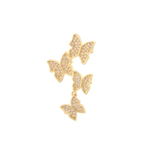 Detailed macro view of gold-plated butterfly earrings featuring pavé-set cubic zirconia crystals