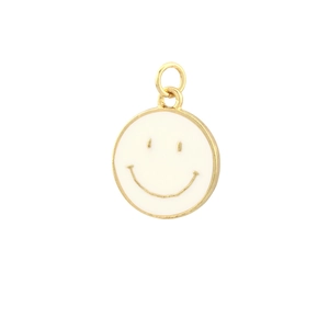 Detaillierte Nahaufnahme eines runden vergoldeten Smileys mit weißer Emaille-Oberfläche