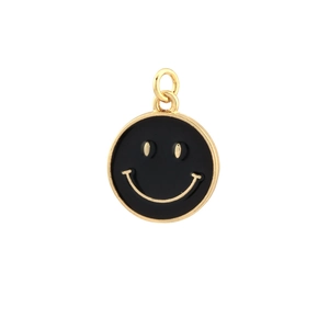 Detail eines runden vergoldeten Smileys mit schwarzer Emaille für die Schmuckherstellung