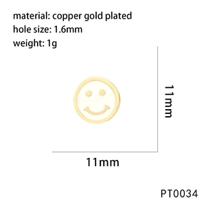 Macro view of a gold-plated copper smiley face bead with 1.6mm hole for jewelry making
