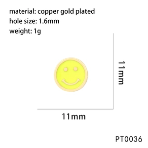 Macro shot of 11mm yellow enamel smiley face charm bead in gold plated copper finish