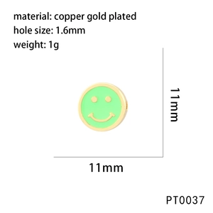 Detailed view of an 11mm neon green copper gold-plated smiley face bead with a 1.6mm hole