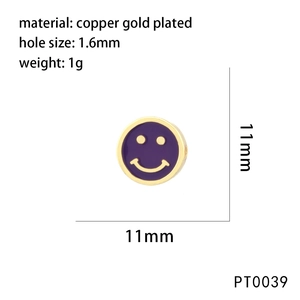 Detail view of a 11mm purple enamel smiley face charm made of copper gold plated metal