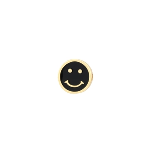 Macro detail of gold plated bead with black enamel smiley face and side hole for DIY jewelry