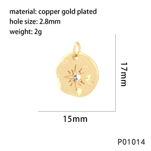 Detail view of 15x17mm gold plated copper pendant with star engraving and cubic zirconia