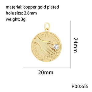 Detail of 24mm gold plated copper pendant featuring a palm and star relief with zircon