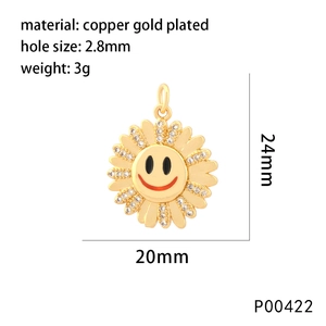 Detail of sunflower smile pendant in gold plated copper with white stone accents