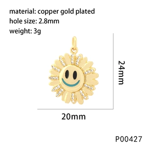 Detail of copper gold plated sunflower pendant with smiley face and white cubic zirconia