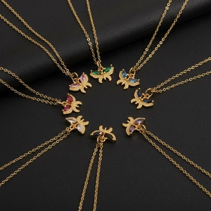 Macro shot of butterfly pendants with colorful zircon stones in eight vibrant variations