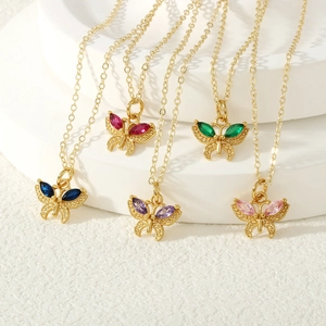 Macro view of five colorful butterfly pendants with gold plating and zircon inlay details