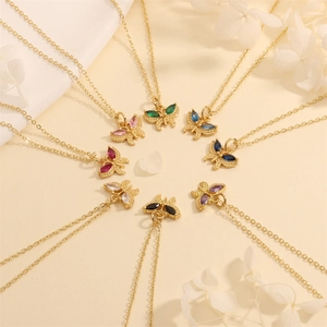 Close-up of butterfly necklaces with colorful zircon stones on gold chains