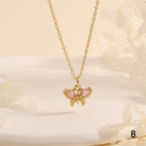 Detailed macro view of 18K gold plated butterfly pendant with pink marquise zircon stones