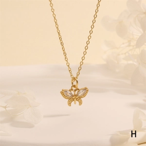 Close-up of butterfly pendant necklace with 18K gold plating and clear zircon inlay