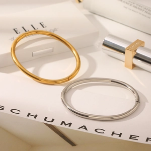 Minimalist 18K gold and silver stainless steel hinged bangles with a polished finish
