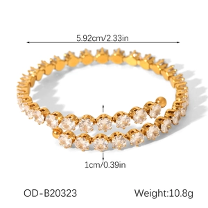 Detailed view of gold plated spiral ring bracelet with cubic zirconia and dimension labels