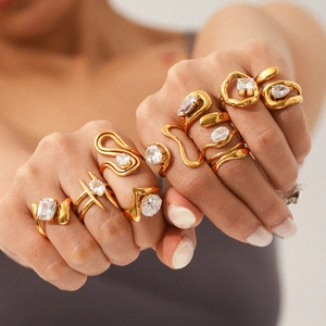 Detailed view of layered gold organic rings with sparkling assorted zircon crystals