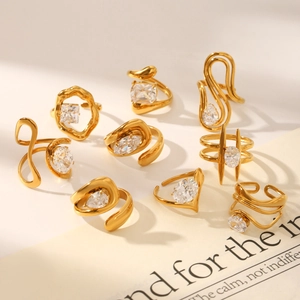 9-piece set of gold geometric open rings with sparkling teardrop and round zircon stones