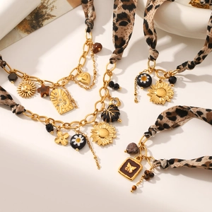 Bohemian gold chain necklace with leopard print fabric and mixed nature charms