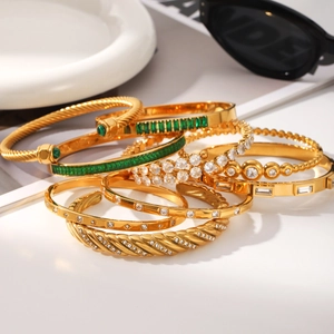 Set of 18k gold plated stainless steel bangles with zircons and emerald stones