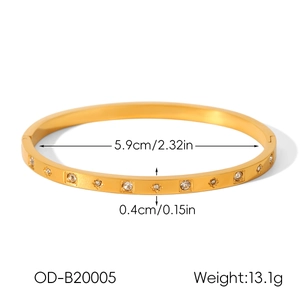 Detail view of 18k gold plated bangle showing 5.9cm diameter and 0.4cm width specs