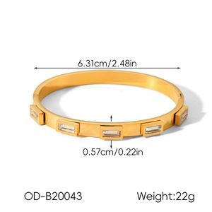 Detailed view of 18k gold plated stainless steel bangle with five rectangle zircon stones