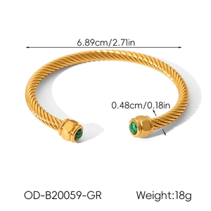 Detail view of 18k gold plated twisted cable bangle with green stone ends and dimensions