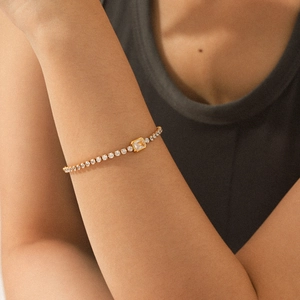 Pulsera tennis de acero bañado en oro 18K con circón amarillo central de talla esmeralda