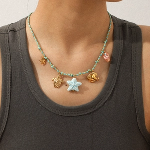 Bohemian braided ocean necklace with starfish, turtle, and fish charms for women
