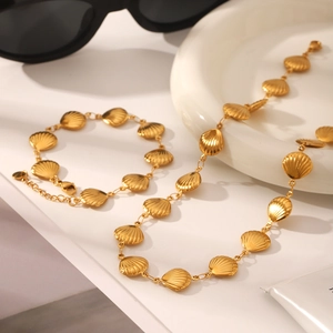 18K gold plated stainless steel jewelry set with scallop shell pendants on a necklace and bracelet