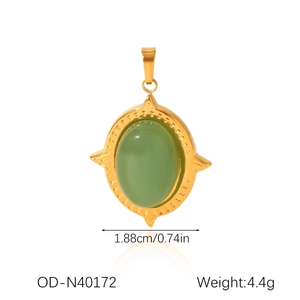 Detail of 18K gold stainless steel pendant with green oval stone and sunburst star frame