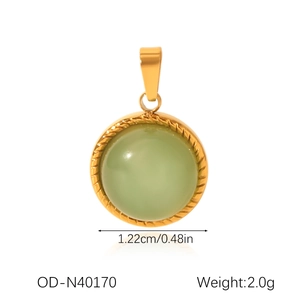 Detail of round gold-edged pendant with light green gem and rope-textured frame
