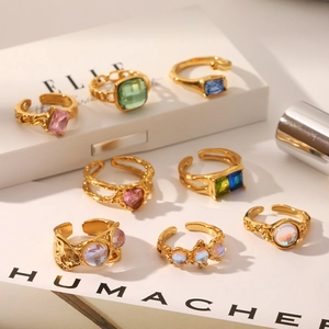 Collection of retro gold-plated stainless steel moonstone rings in varied geometric designs