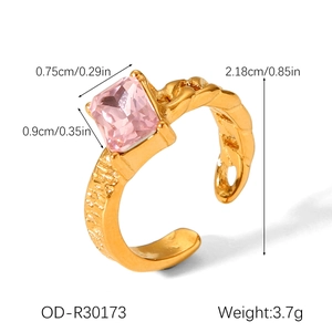 Detail view of pink moonstone ring showing adjustable gold band and product dimensions