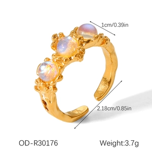 Detail showing dimensions of a gold irregular lava ring with iridescent moonstones