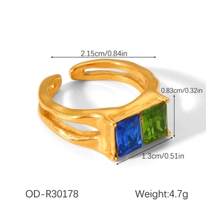 Detail of gold hammered ring with rectangular blue and green stones and 4.7g weight info