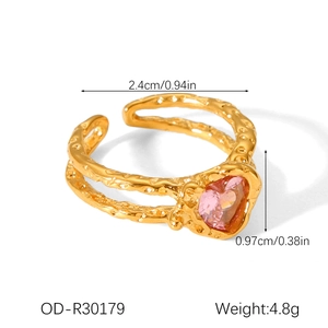 Detail of pink heart gemstone on a gold-plated hammered texture adjustable ring